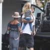 Pink, son mari Carey Hart et leur fille Willow devant leur domicile à Los Angeles, le 19 juillet 2014.