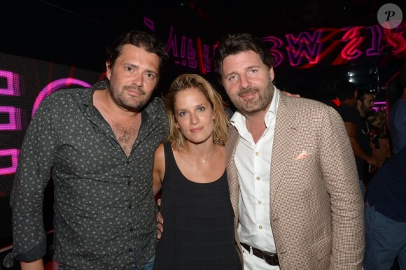 Exclusif - Philippe Cura, sa femme Audrey et Philippe Lellouche au VIP Room à Saint-Tropez, le 23 juillet 2014.