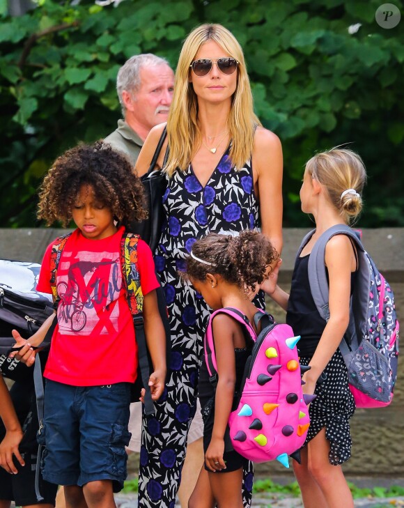 Heidi Klum et ses enfants Leni et Henry se promènent à Central Park à New York, le 11 juillet 2014. 