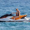 Lindsay Lohan fait du jet ski pendant ses vacances à Ibiza, le 30 juillet 2014.