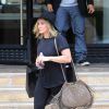 Hilary Duff quitte le centre commercial Barneys New York à Beverly Hills, tout de noir vêtue avec un sac à franges Chanel et des bottines Isabel Marant (modèle Andrew). Los Angeles, le 3 août 2014.