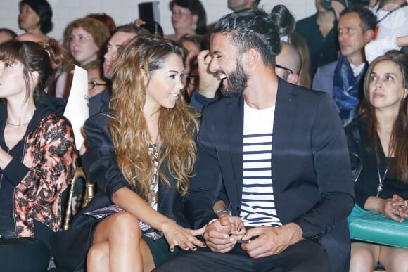 Nabilla et son compagnon Thomas Vergara au défilé Jean-Paul Gaultier à Paris, le 9 juilllet 2014.