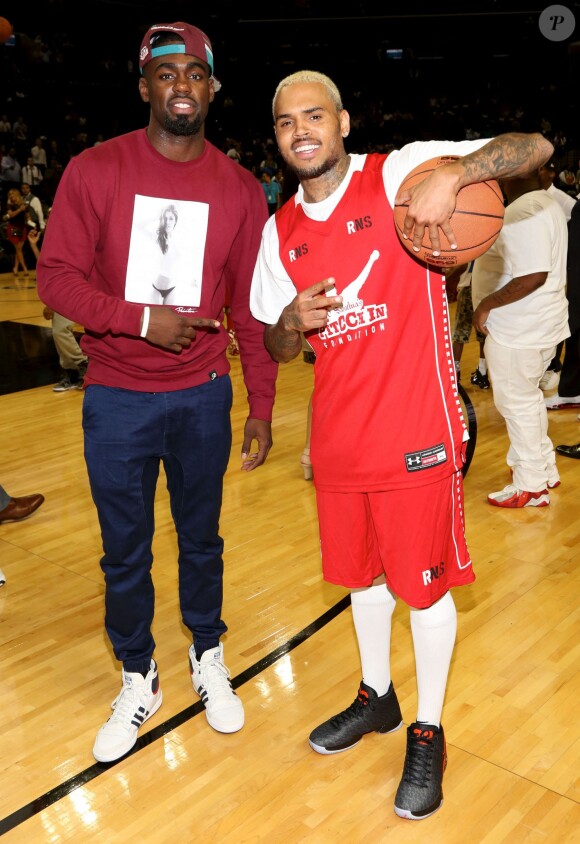 Rihanna assiste à un match caritatif de basketball à New York auquel Chris Brown participe, le 21 août 2014.