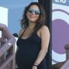 Mila Kunis, très enceinte, est allée déjeuner avec une amie après un cours de yoga à Los Angeles, le 23 août 2014.
