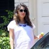 Exclusif - Mila Kunis enceinte se rend chez une amie à Beverly Hills, le 9 août 2014.