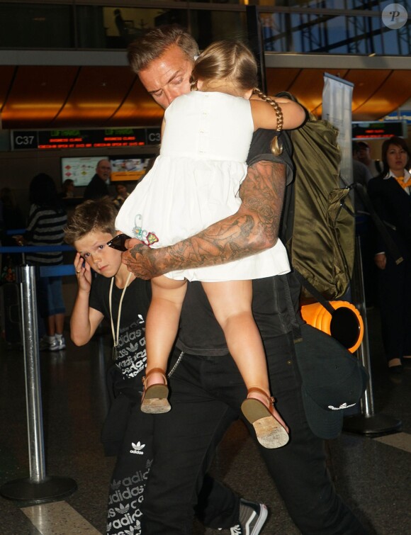 David Beckham et sa fille Harper à l'aéroport LAX à Los Angeles, le 29 août 2014