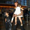 David Beckham et ses enfants Romeo, Cruz, et Harper surpris à l'aéroport LAX à Los Angeles, le 29 août 2014