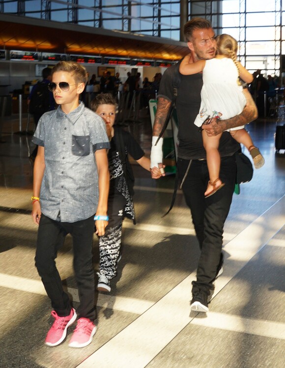 David Beckham et ses enfants Romeo, Cruz, et Harper sur le départ à l'aéroport LAX à Los Angeles, le 29 août 2014