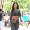 Rihanna, sexy en crop-top et legging Alexander Wang pour H&M (collection disponible à partir du 6 novembre), se balade dans le quartier de SoHo. New York, le 7 septembre 2014.