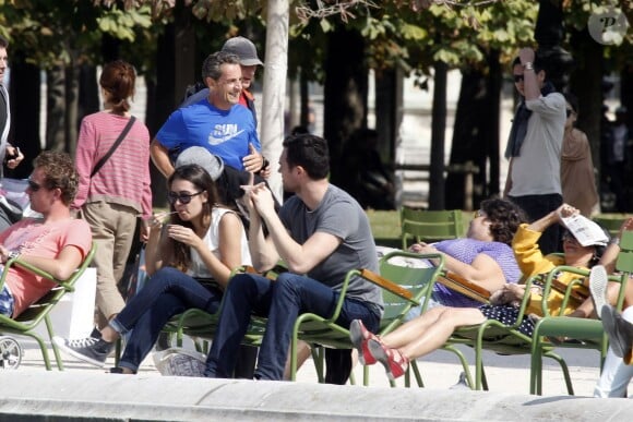 Nicolas Sarkozy en train de faire son jogging avec ses gardes du corps au jardin des Tuileries, le 10 septembre 2014, à Paris.