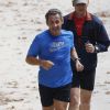 Nicolas Sarkozy en train de faire son jogging avec ses gardes du corps au jardin des Tuileries, le 10 septembre 2014, à Paris.
