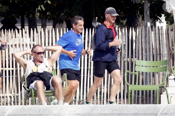 Nicolas Sarkozy en train de faire son jogging au jardin des Tuileries, le 10 septembre 2014, à Paris.
