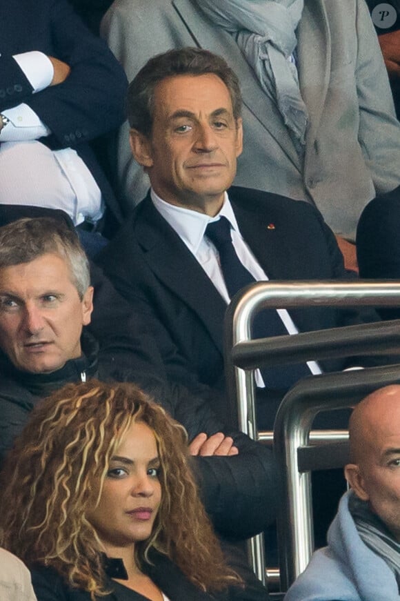 Nicolas Sarkozy assiste au match de football entre le PSG et Lyon au Parc des Princes à Paris le 21 septembre 2014.