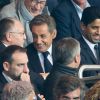 Jean-Michel Aulas, Nicolas Sarkozy, Nasser Al-Khelaïfi assistent au match de foot entre le PSG et Lyon au Parc des Princes à Paris le 21 septembre 2014.