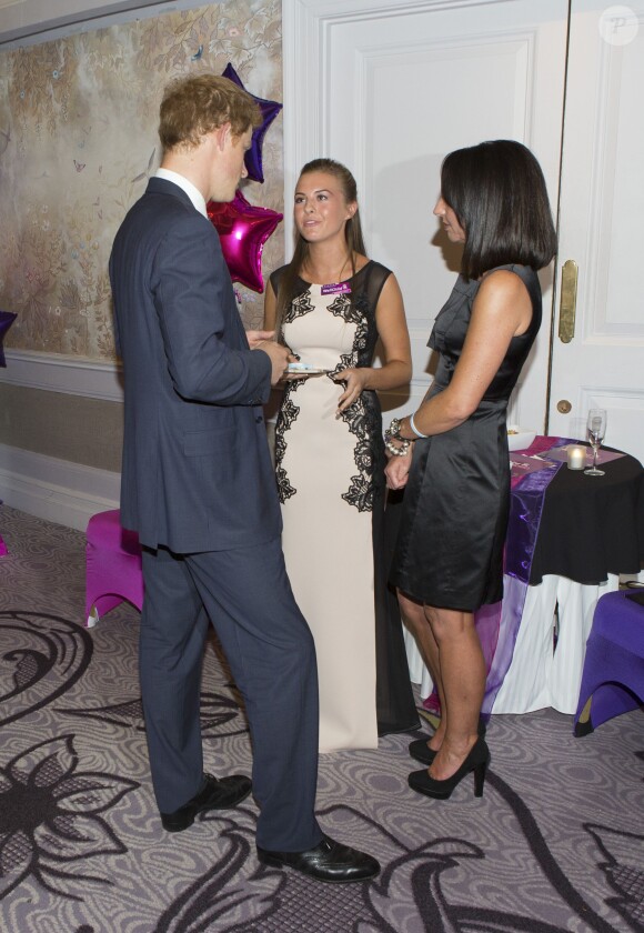 Le prince Harry lors de la cérémonie des 10e WellChild Awards, le 22 septembre 2014 au Hilton de Londres, remis par l'association WellChild qui soutient les enfants malades, dont il est le parrain depuis 2007.