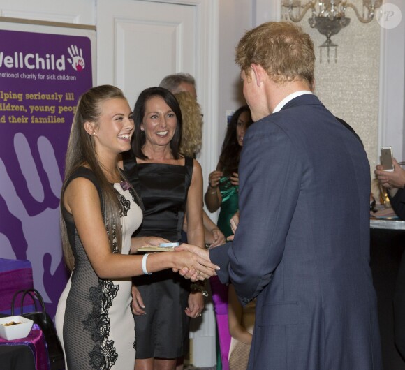 Le prince Harry lors de la cérémonie des 10e WellChild Awards, le 22 septembre 2014 au Hilton de Londres, remis par l'association WellChild qui soutient les enfants malades, dont il est le parrain depuis 2007.