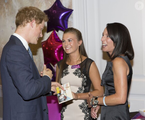 Le prince Harry lors de la cérémonie des 10e WellChild Awards, le 22 septembre 2014 au Hilton de Londres, remis par l'association WellChild qui soutient les enfants malades, dont il est le parrain depuis 2007.