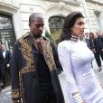 Kanye West et Kim Kardashian quittent le Royal Monceau, pour se rendre au défilé Balmain. Paris, le 25 septembre 2014.