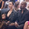 Kim Kardashian, North et Kanye West assistent au défile Givenchy printemps-été 2015 au lycée Carnot. Paris, le 28 septembre 2014.