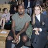 Kanye West et Gaia Repossi assistent au défilé Céline printemps-été 2015 au Tennis Club de Paris. Paris, le 28 septembre 2014.