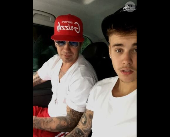 Justin Bieber et son père Jérémy en vacances, le 5 octobre 2014