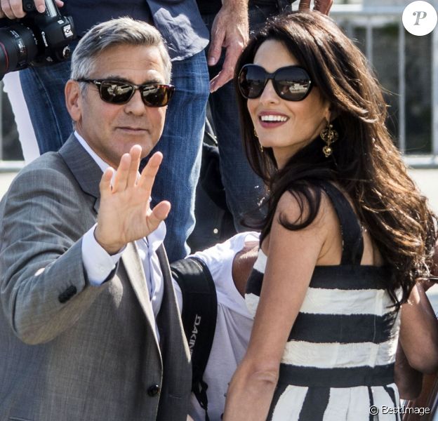 George Clooney et sa fiancée Amal Alamuddin (en Dolce &amp; Gabbana) arrivent à Venise le 26 septembre 2014. Ils vont célébrer leur mariage !