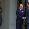 François Hollande et Arnold Schwarzenegger - Le président français reçoit en entretien M. Arnold Schwarzenegger, ancien gouverneur de l'Etat de Californie, fondateur et vice-président du réseau des régions pour le Climat "R 20", au palais de l'Elysée à Paris, le 10 octobre 2014.
