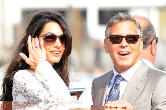 George Clooney et sa femme Amal Alamuddin quittent l'hôtel Aman, où ils ont passé leur nuit de noces à Venise, le 28 septembre 2014.