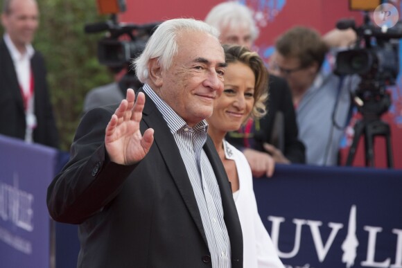 Dominique Strauss-Kahn et sa compagne Myriam L'Aouffir - Avant-première du film "Sin City" lors du 40e Festival du Cinéma Américain de Deauville, le 13 septembre 2014.