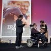 Fabien Héraud recoit le Trophée d'Honneur avec le réalisateur Nils Tavernier pour le film 'De Toutes Nos Forces' lors des 10e Trophées APAJH (Association Pour Adultes et Jeunes Handicapés) 2014 au Carrousel du Louvre. Paris, le 17 novembre 2014.