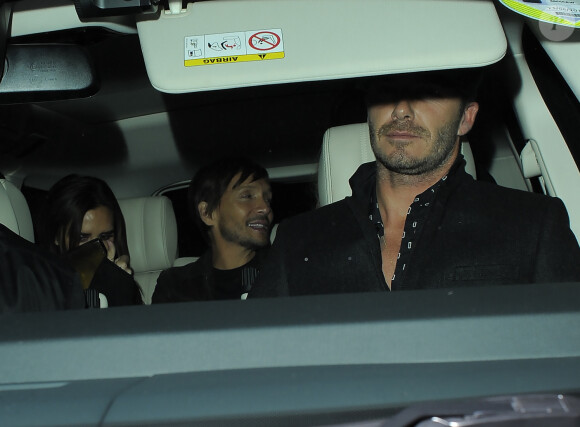Victoria Beckham, Ken Paves et David Beckham lors de la soirée du magazine Another Man au Mark's Club. Londres, le 20 novembre 2014.