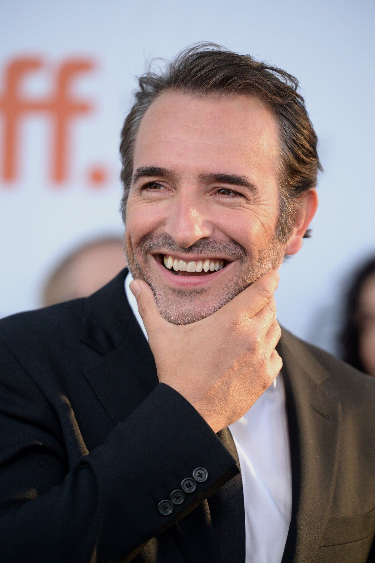 Photo : Jean Dujardin tout sourire au Toronto International Film Festival  le 12 septembre 2014. - Purepeople