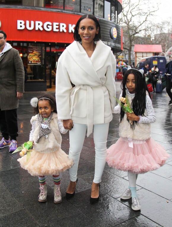 La chanteuse juge de The X Factor Mel B et ses deux filles Angel et Madison (7 et 3 ans) se rendent à une avant-première du film Legend of the Neverbeast à Londres. Le 7 décembre 2014.