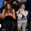 Sylvester Stallone et ses filles Sistine, Sophia et Scarlet lors d'un match de basket des Lakers à Los Angeles, le 7 décembre 2014.