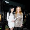 Les soeurs Lohan, Ali et Lindsay, assistent à la soirée de Noël organisée par le magazine LOVE et Balmain à l'Ivy Market Grill. Londres, le 15 décembre 2014.