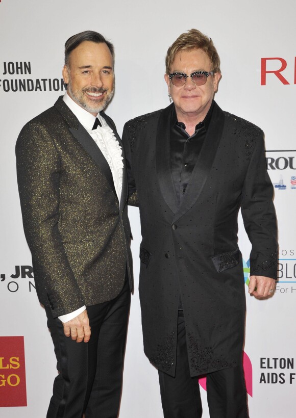David Furnish et Elton John - People au gala AIDS Foundation à New York. Le 28 octobre 2014
