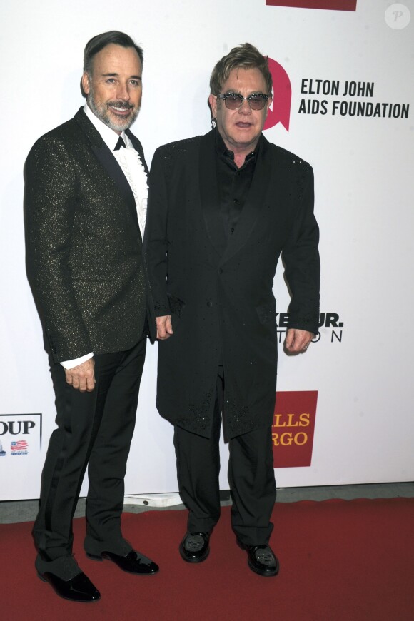 David Furnish et Elton John - People au gala AIDS Foundation à New York. Le 28 octobre 2014