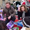 Valérie Trierweiler, guest - Distribution des cadeaux de Noël aux enfants du Secours Populaire sur les Champs-Elysées à Paris, le 20 décembre 2014.