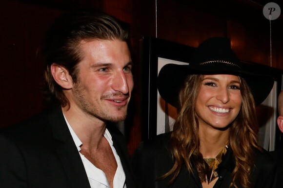 Laury Thilleman et son compagnon Nicolas Tesic à la soirée de lancement du livre "Johnny Hallyday on the road" de Renaud Corlouer au Buddha-Bar à Paris, le 18 novembre 2014.