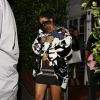 Rihanna quitte le restaurant Giorgio Baldi avec sa nièce Majesty dans les bras, à l'issue d'un dîner en famille. Santa Monica, Los Angeles, le 10 février 2015.