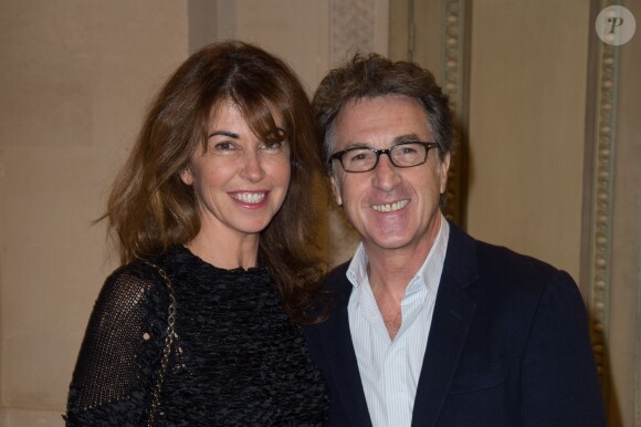 François Cluzet et sa femme Narjiss lors de la remise de la Médaille d'Or de l'Académie des Arts et Techniques du Cinéma à Luc Besson, à la Monnaie de Paris, le 19 janvier 2015