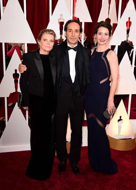 Alexandre Desplat, Dominique LeMonnier et leur fille lors de la 87e cérémonie des Oscars à Los Angeles le 22 février 2015