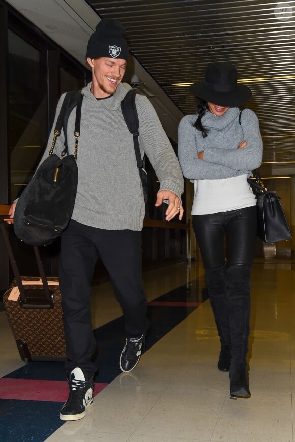 Glee star Naya Rivera and her husband Ryan Dorsey are camera shy at LAX as they head home after the holidays, Los Angeles, CA, USA on November 30, 2014. The sexy actress hid her makeup free face under her large brimmed hat as she walked with her man to their car. Photo by GSI/ABACAPRESS.COM01/12/2014 - Los Angeles