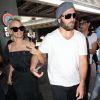 Pamela Anderson arrive avec son mari Rick Salomon à l'aéroport de Nice pour le festival de Cannes, le 13 mai 2014.