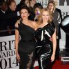 Kylie Minogue et Dannii Minogue à la soirée des "Brit Awards 2014" en partenariat avec MasterCard à Londres, le 19 février 2014.