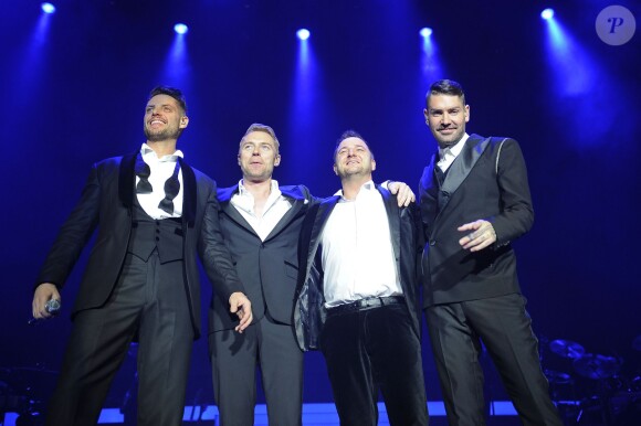 Keith Duffy, Ronan Keating, Mikey Graham, Shane Lynch Le groupe Boyzone en concert au Wembley Arena a Londres, le 21 decembre 2013. 