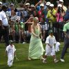 Lindsey Vonn au côté de Tiger Woods et ses enfants Sam et Charlie lors du Par 3 Contest en marge du Masters d'Augusta, à Augusta, le 8 avril 2015