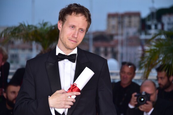 László Nemes (Grand Prix pour le film Le Fils de Saul) - Photocall de la remise des palmes du 68 ème Festival du film de Cannes, le 24 mai 2014.