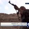 Michael Enright avec son AK-47 sur une télé arabe.