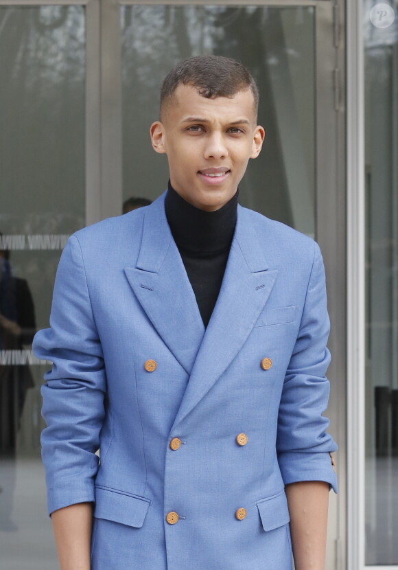 Stromae  à la sortie du défilé de mode Louis Vuitton, collection prêt-à-porter automne-hiver 2015/2016, à Paris, le 11 mars 2015